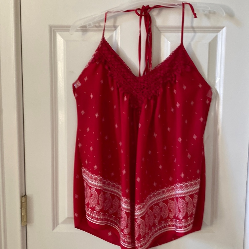 Red Halter top with handkerchief bottom. Appliqué pattern at neck. Medium